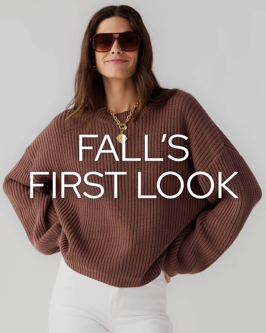 woman wearing sunglasses, sweater, and jeans with words fall's first look