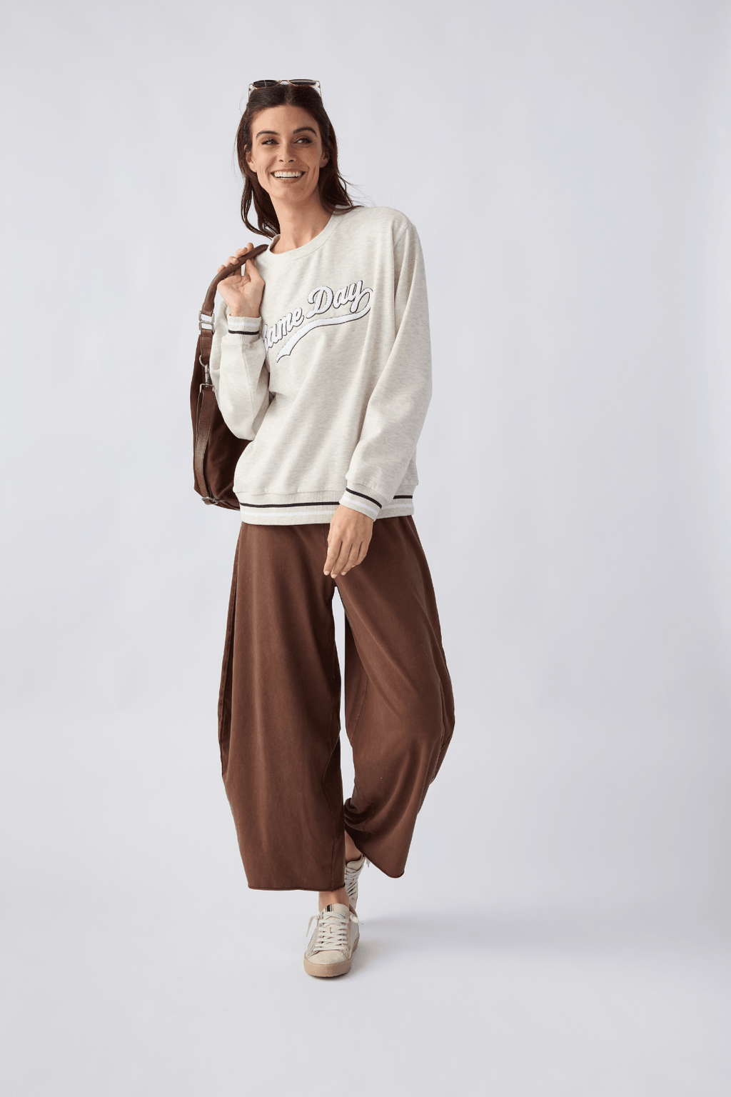 Light gray 'Game Day' sweatshirt with ribbed cuffs and striped edge hem