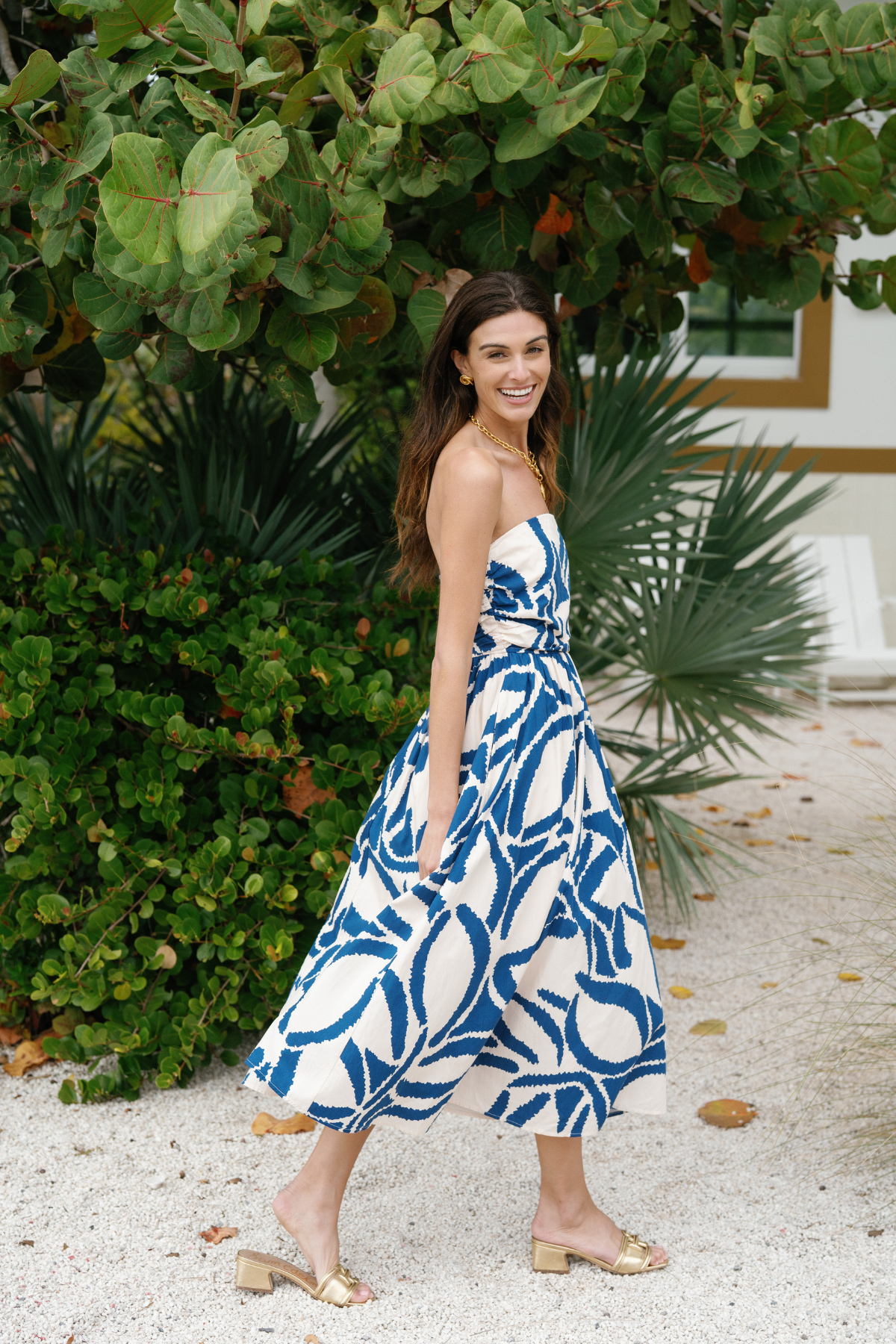 Blue-and-white strapless midi dress with abstract pattern, gathered waist and flared A-line skirt
