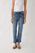 Medium wash straight-leg jeans, five-pocket design with button-and-zip fly.