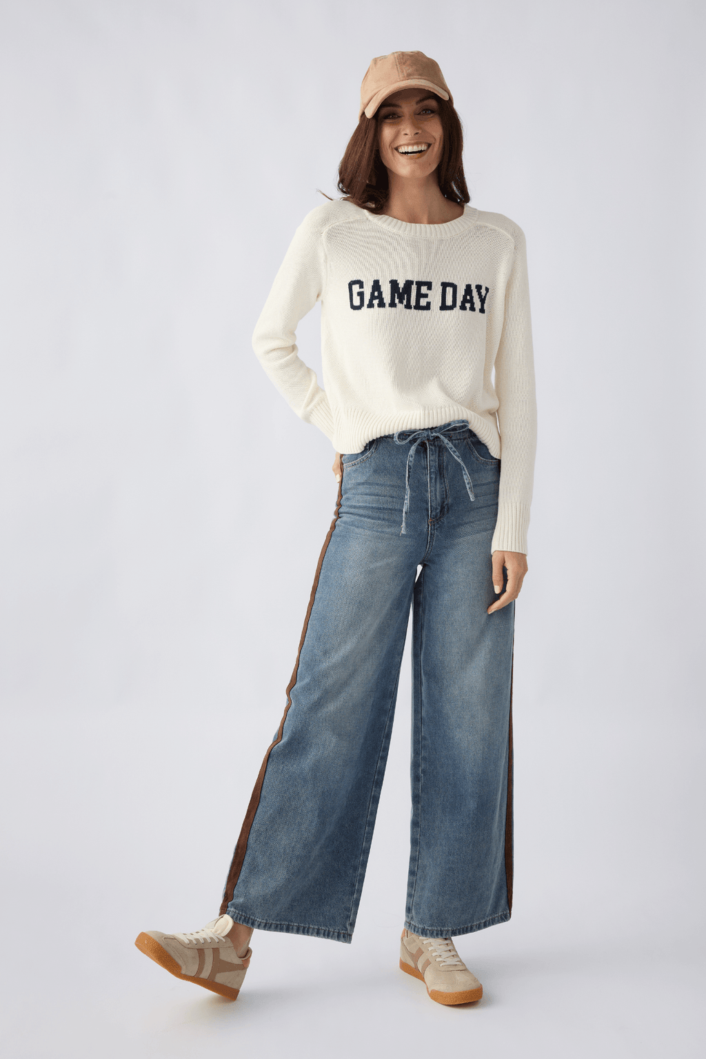 Cream varsity stand-in sweater with 'GAME DAY' text, long sleeves