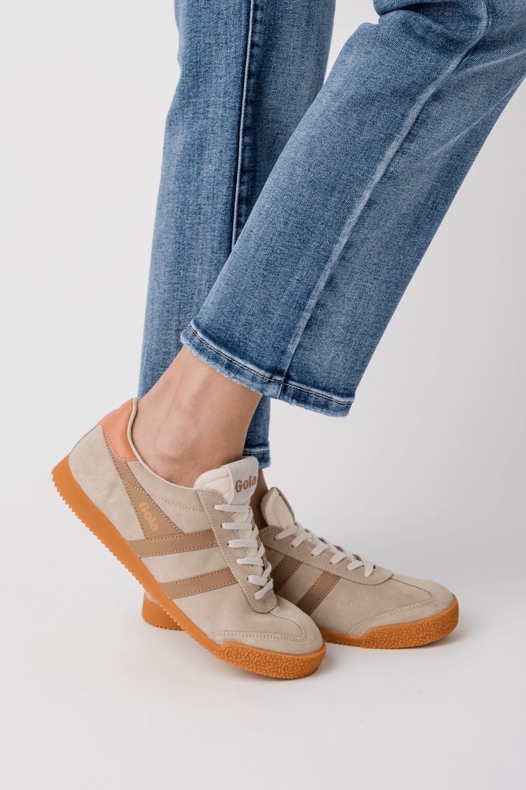 Gola low-top sneakers, bone uppers with caramel striped panels, cream laces, terracotta sole