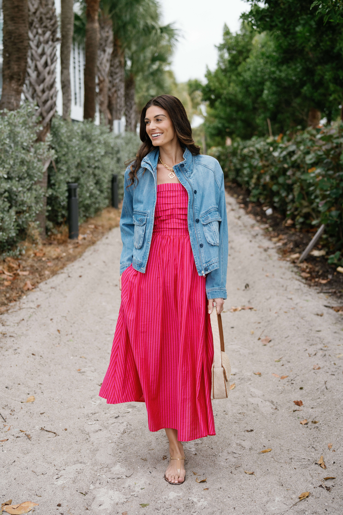 Light blue denim jacket with button-front closure and flap pockets, long sleeves