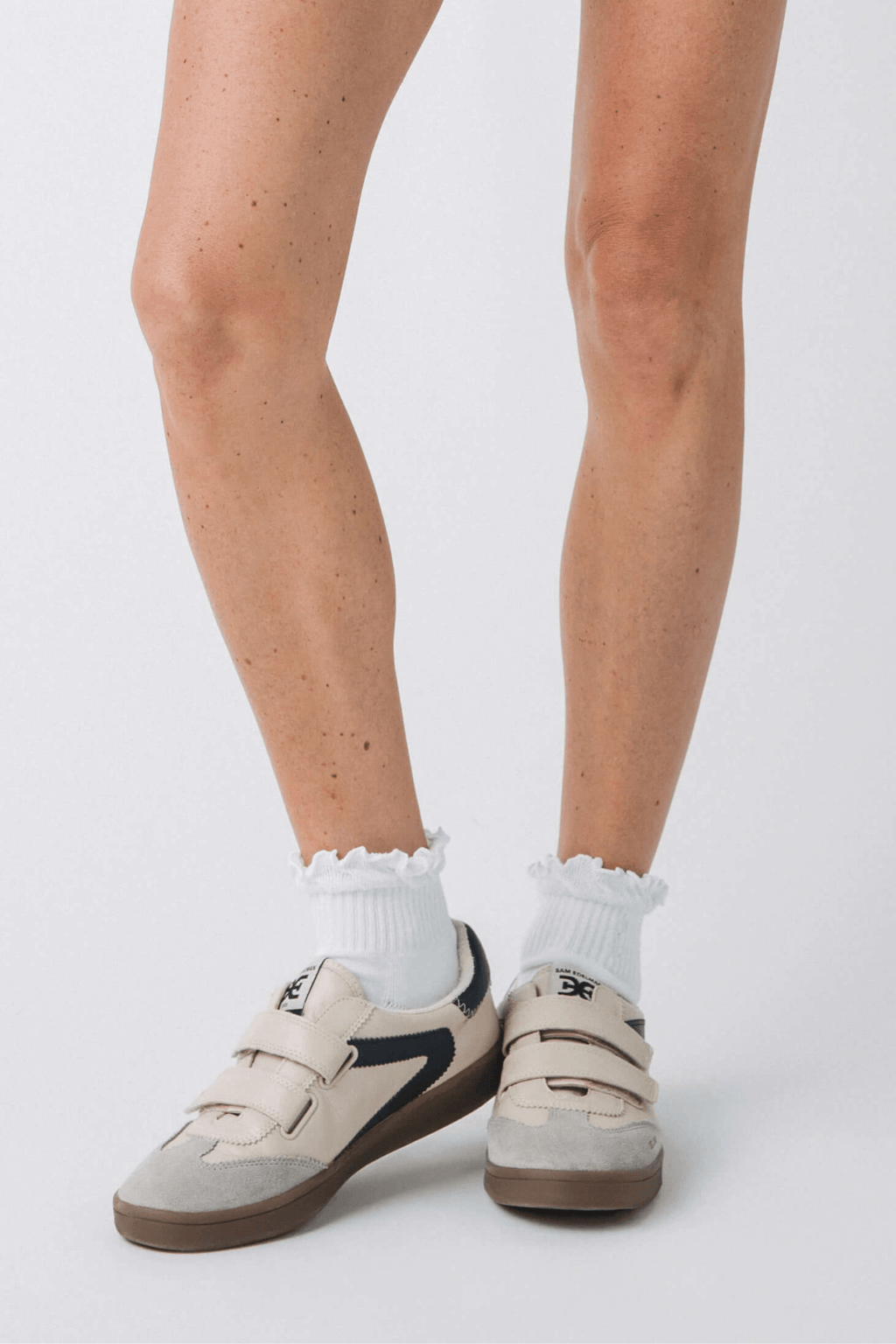 White crew socks with ruffled cuff and ribbed knit
