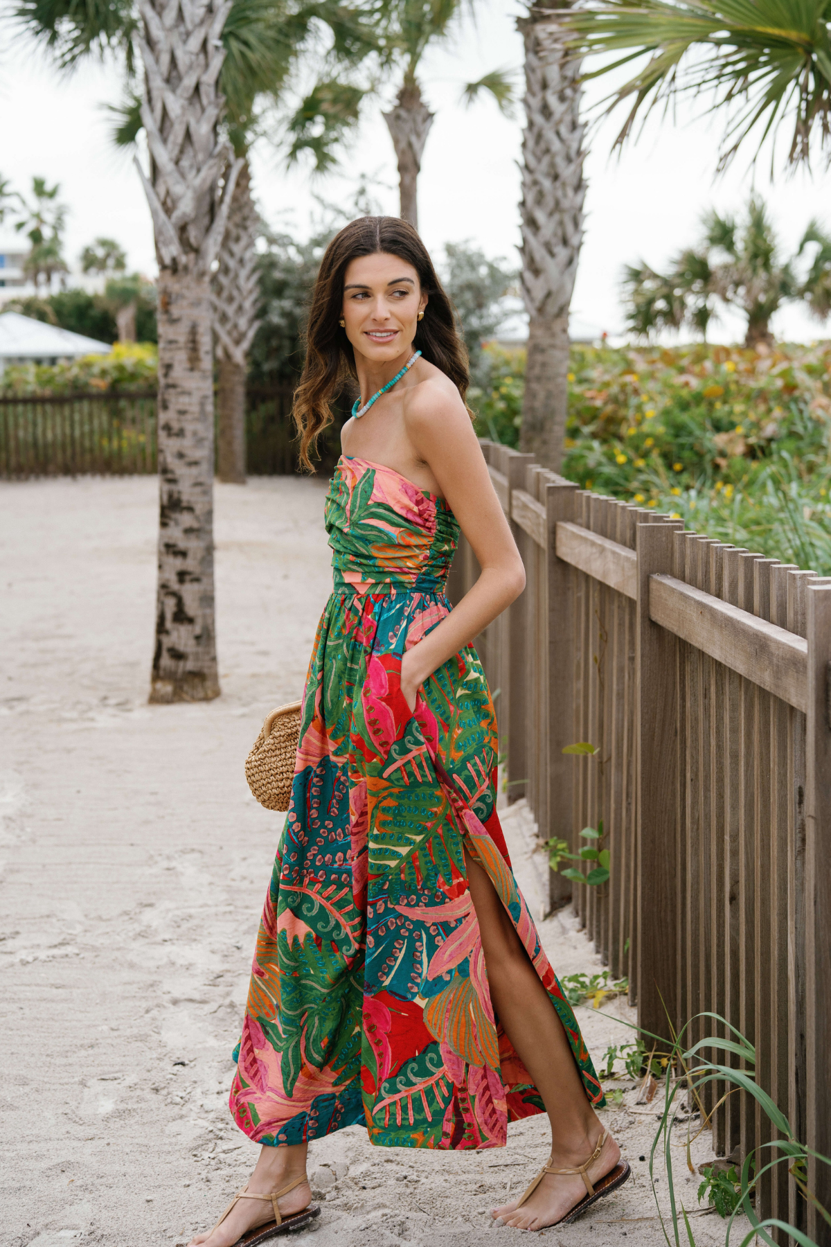 Strapless ruched maxi dress, tropical print with side slit and gathered waist, coral and teal.