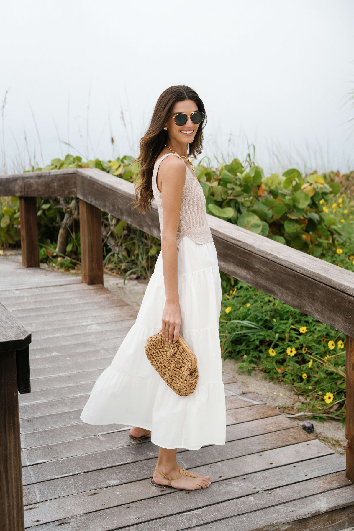 White sleeveless maxi dress with scoop neck and layered tiered skirt
