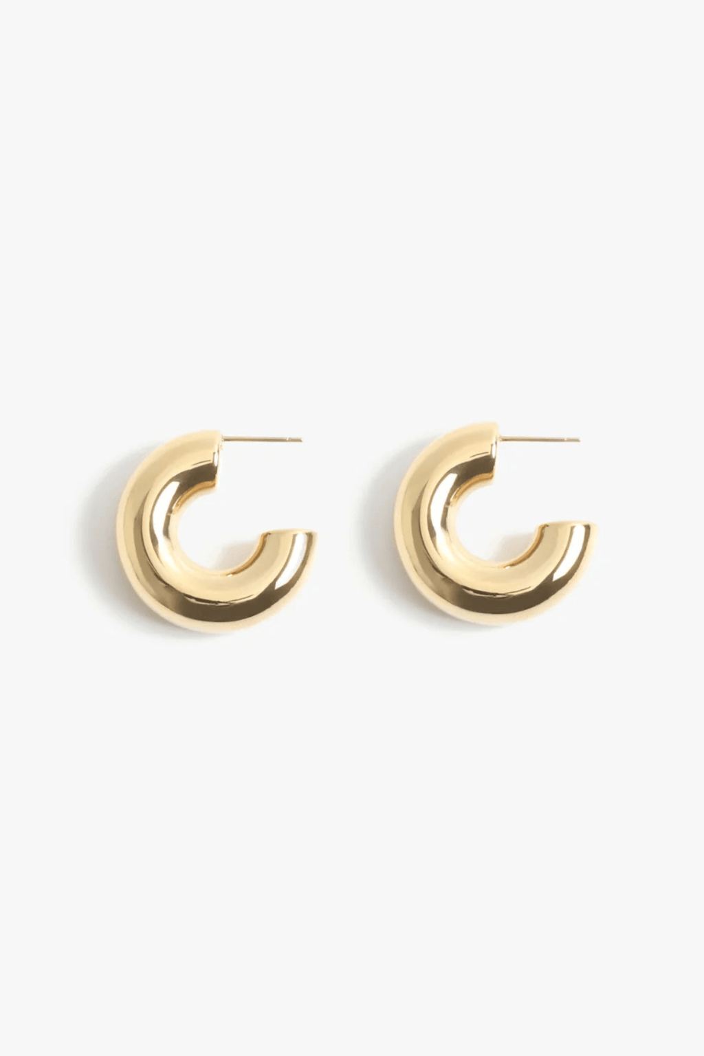 Gold hoop earrings with smooth rounded profile, hinged post closure