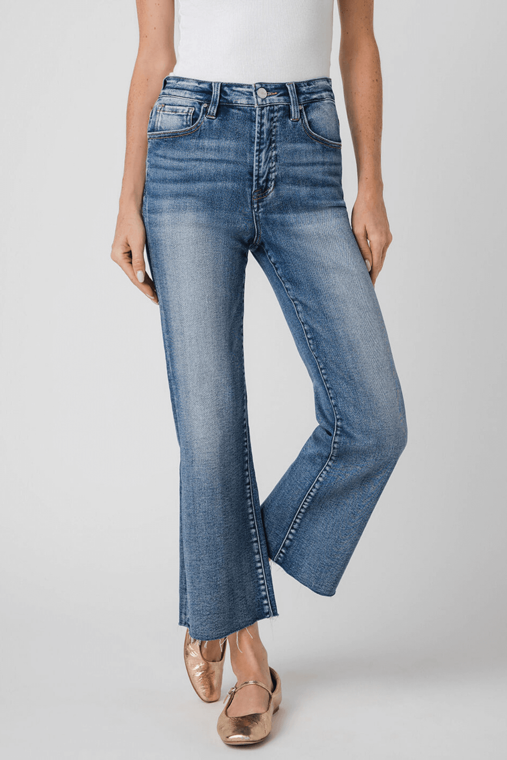 High-rise kick flare jeans in medium-wash blue, front view with classic five-pocket design.