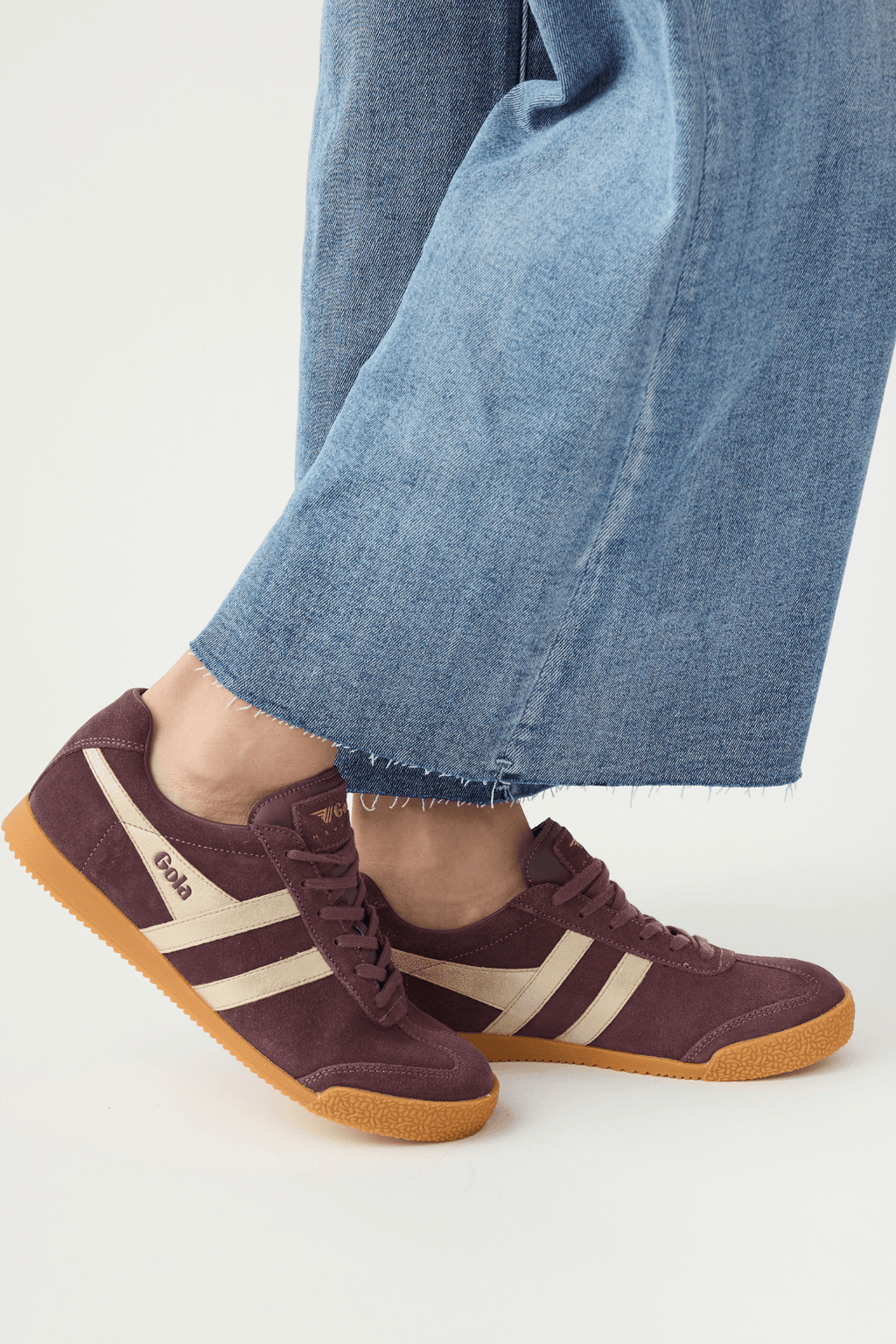 Cocoa brown suede lace-up sneakers with white side stripes and gum rubber sole