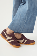 Cocoa brown suede lace-up sneakers with white side stripes and gum rubber sole