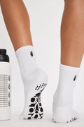 White ribbed pilates grip socks with black toe traction pattern