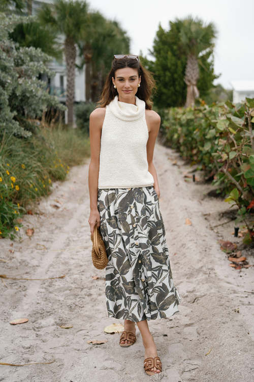 Ivory sleeveless textured knit top with high cowl neckline, front full-length