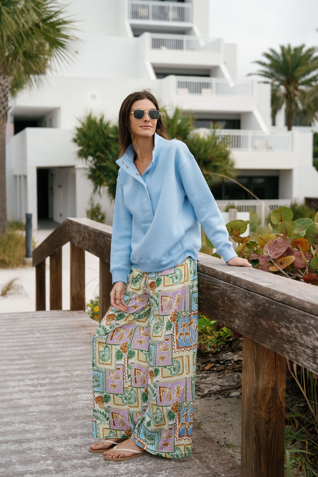 Light-base wide-leg pants with colorful patch print and elastic waistband, front view