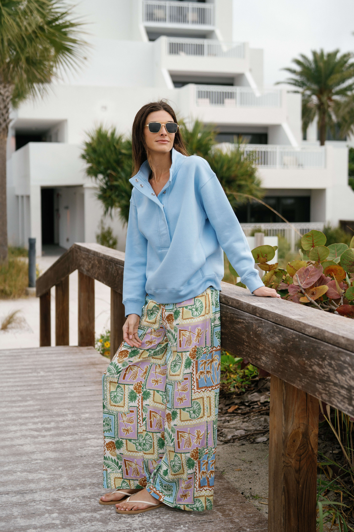 Light-base wide-leg pants with colorful patch print and elastic waistband, front view