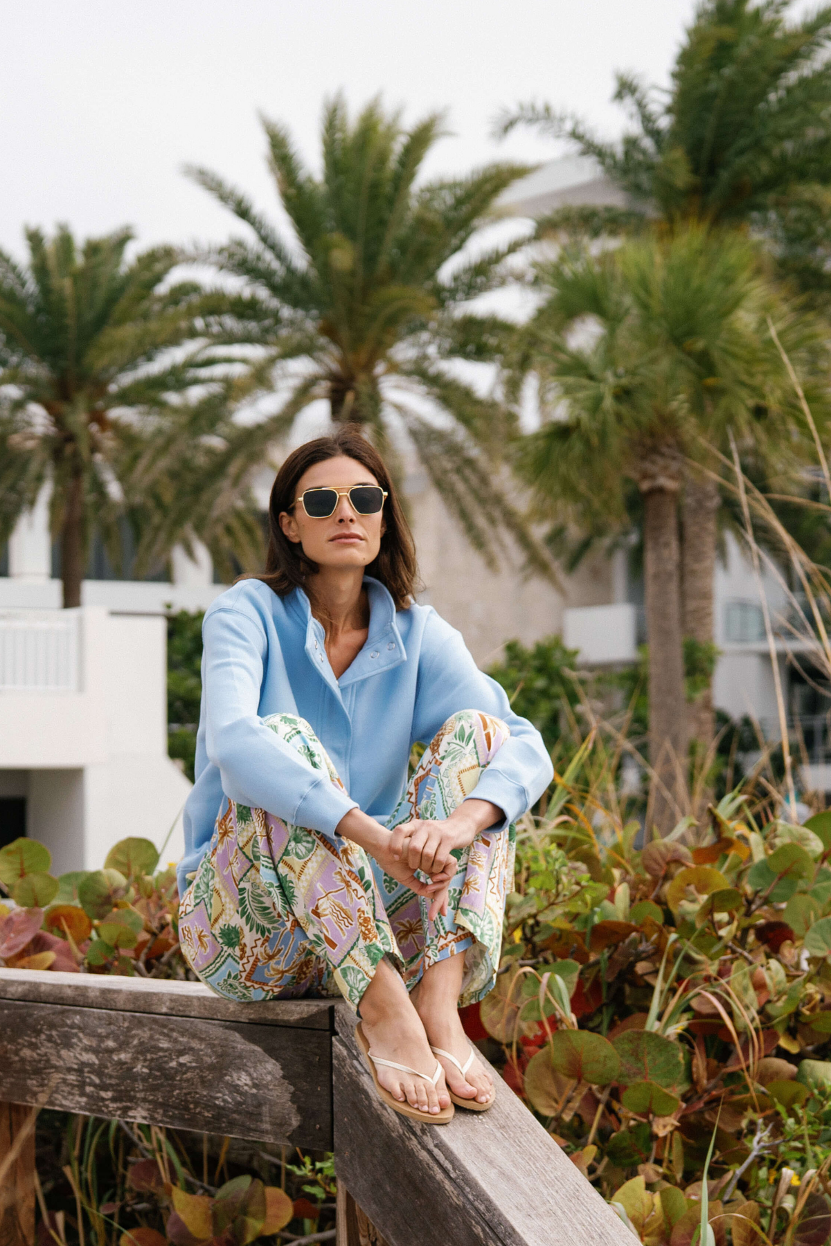 Wide-leg printed pants with colorful patch design and elastic waist, side view