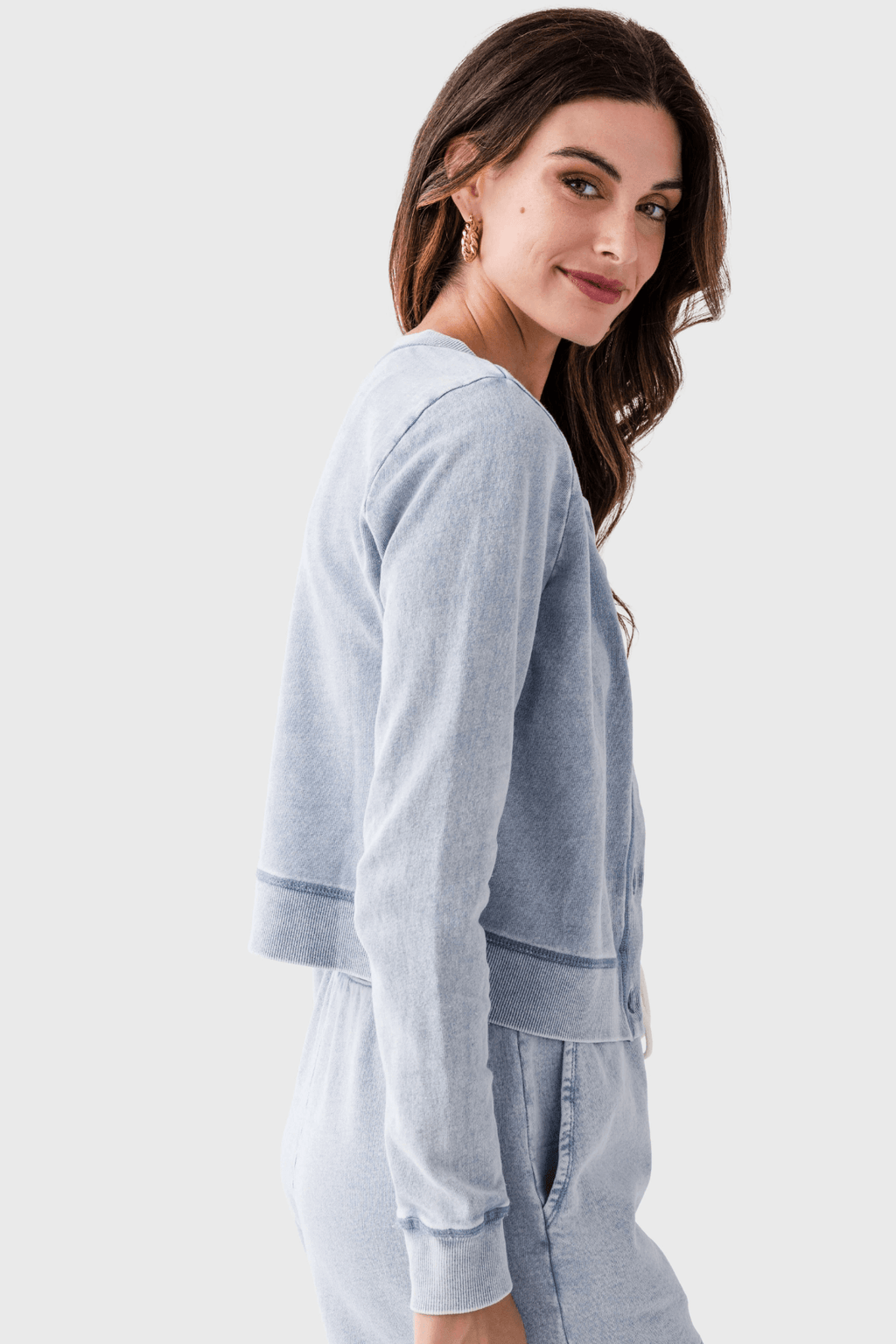 Light blue denim knit cardigan, side view, button front and long sleeves