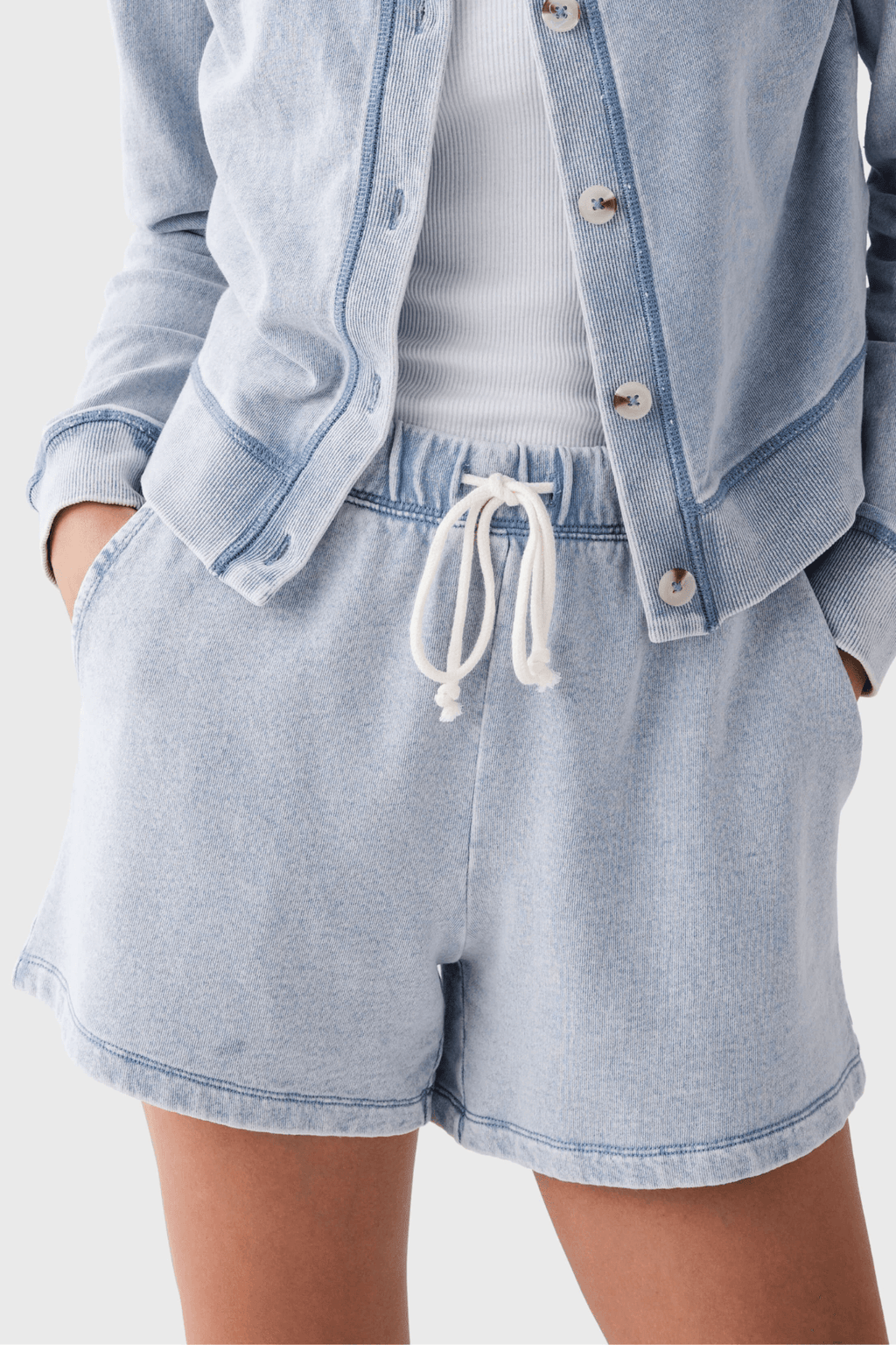 Women’s light blue knit denim shorts, elastic waist with white drawstring