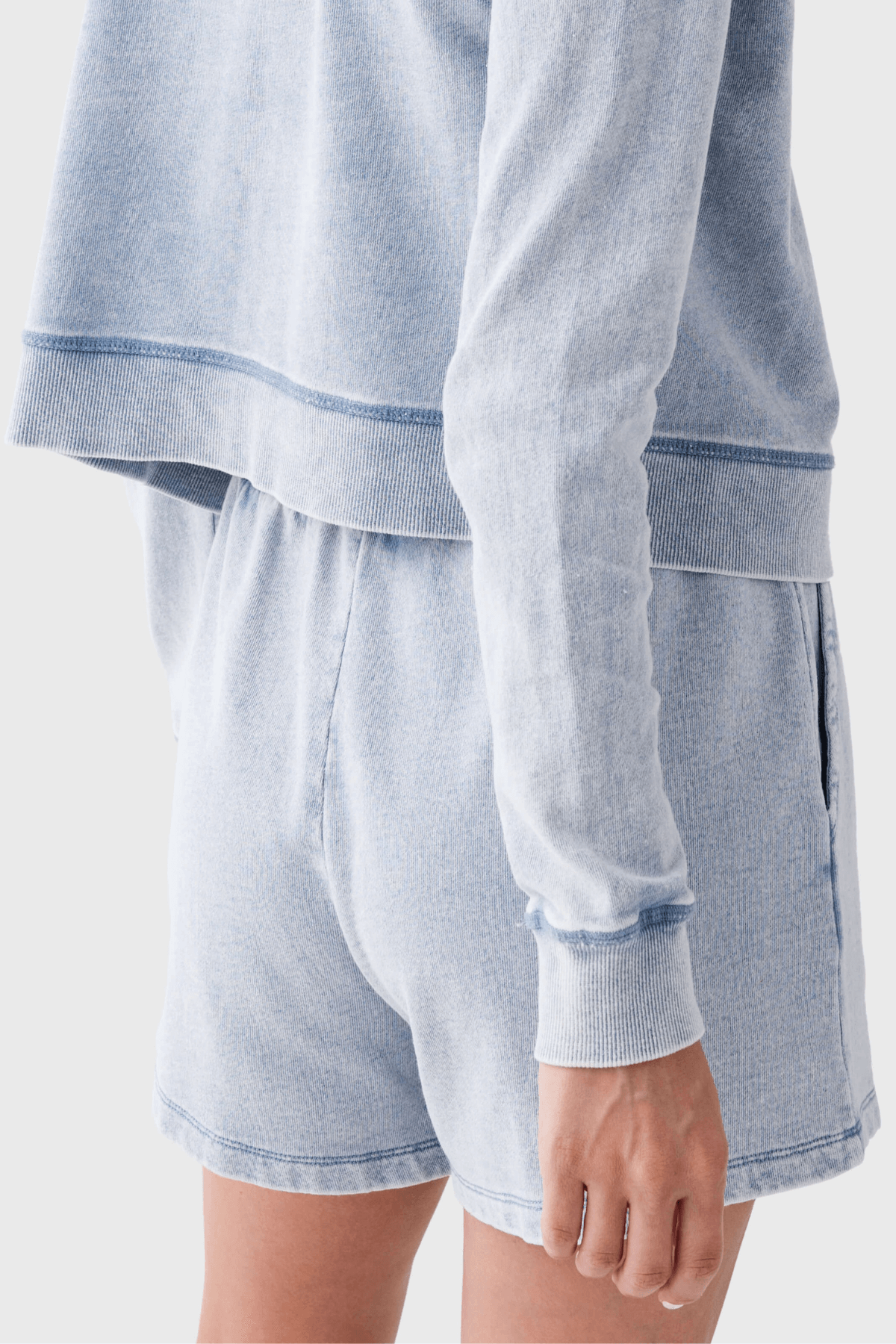 Women’s light blue knit denim shorts with relaxed gathered waist detail