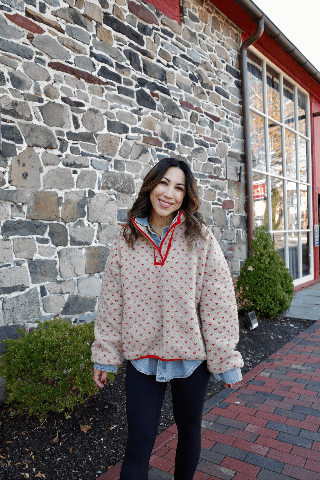 Red patterned button-up shirt with collar and long sleeves