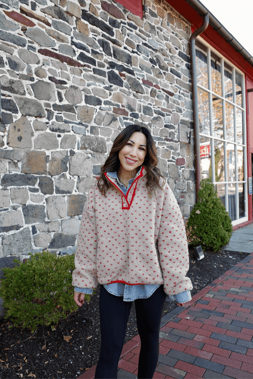 Red patterned button-up shirt with collar and long sleeves