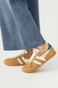 Elan sneakers with tan suede upper, off-white three stripes, green tongue patch, laces.