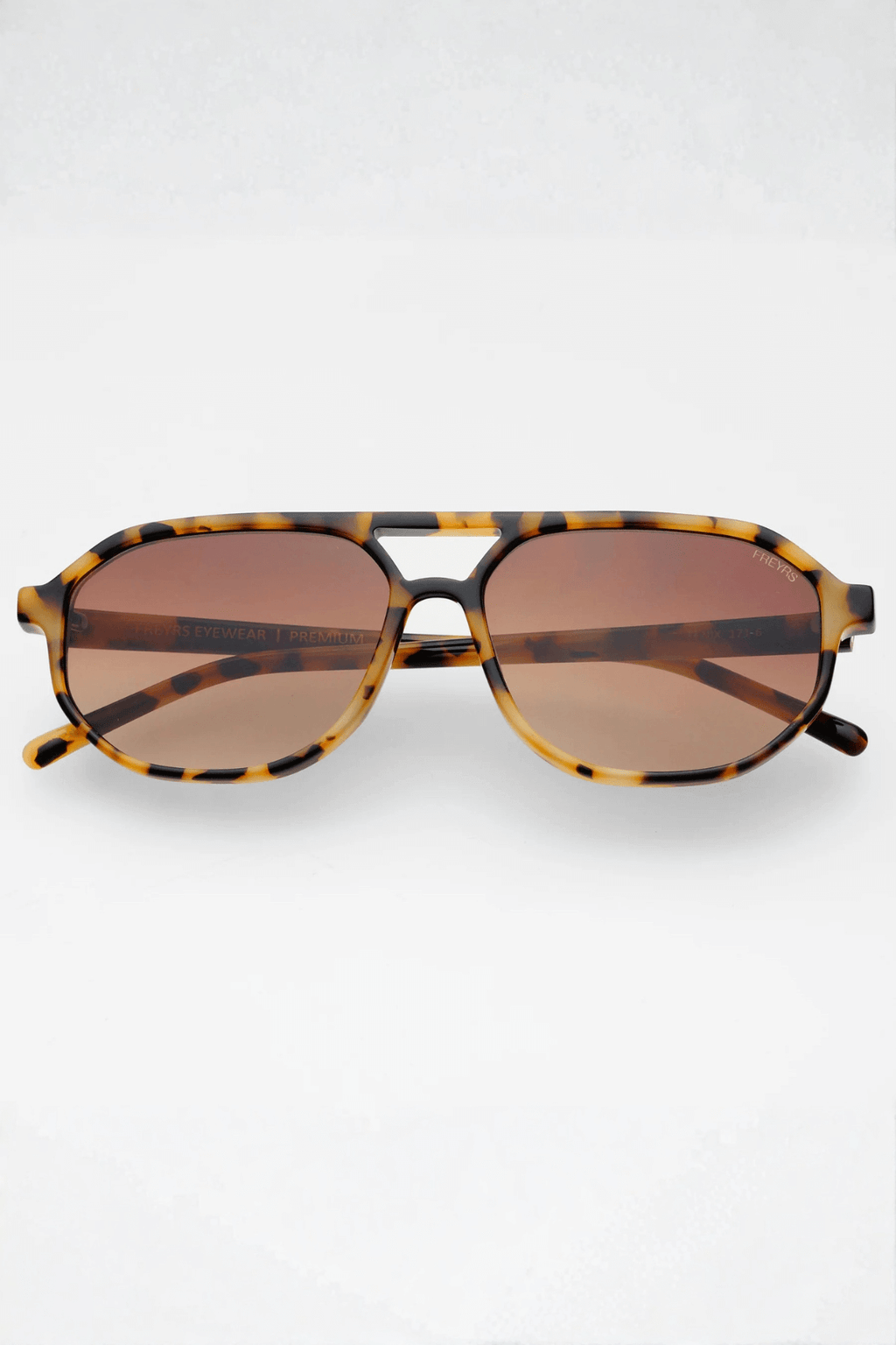 Aviator sunglasses with milky tortoise frame and dark brown tinted lenses
