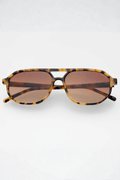 Aviator sunglasses with milky tortoise frame and dark brown tinted lenses