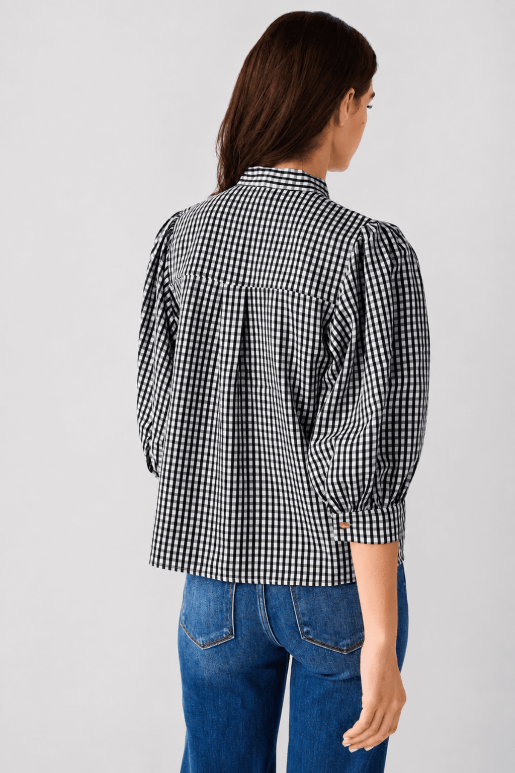 THML gingham tie-neck blouse, back view with gathered puff sleeves