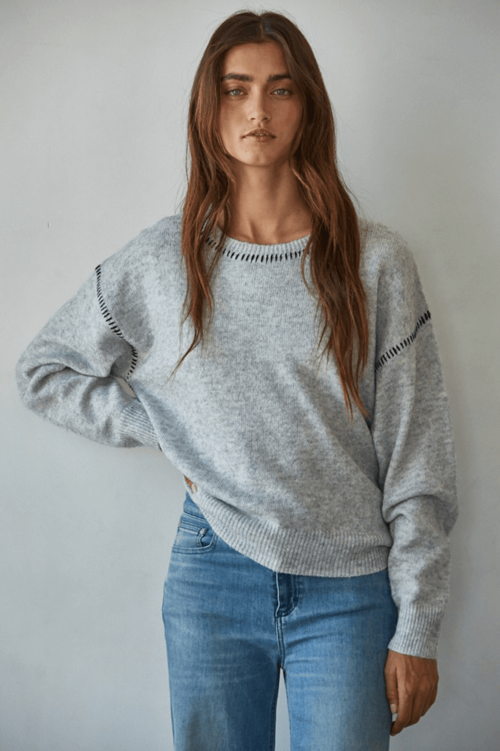 Heather grey crewneck sweater with dark contrast stitch on yoke and sleeves