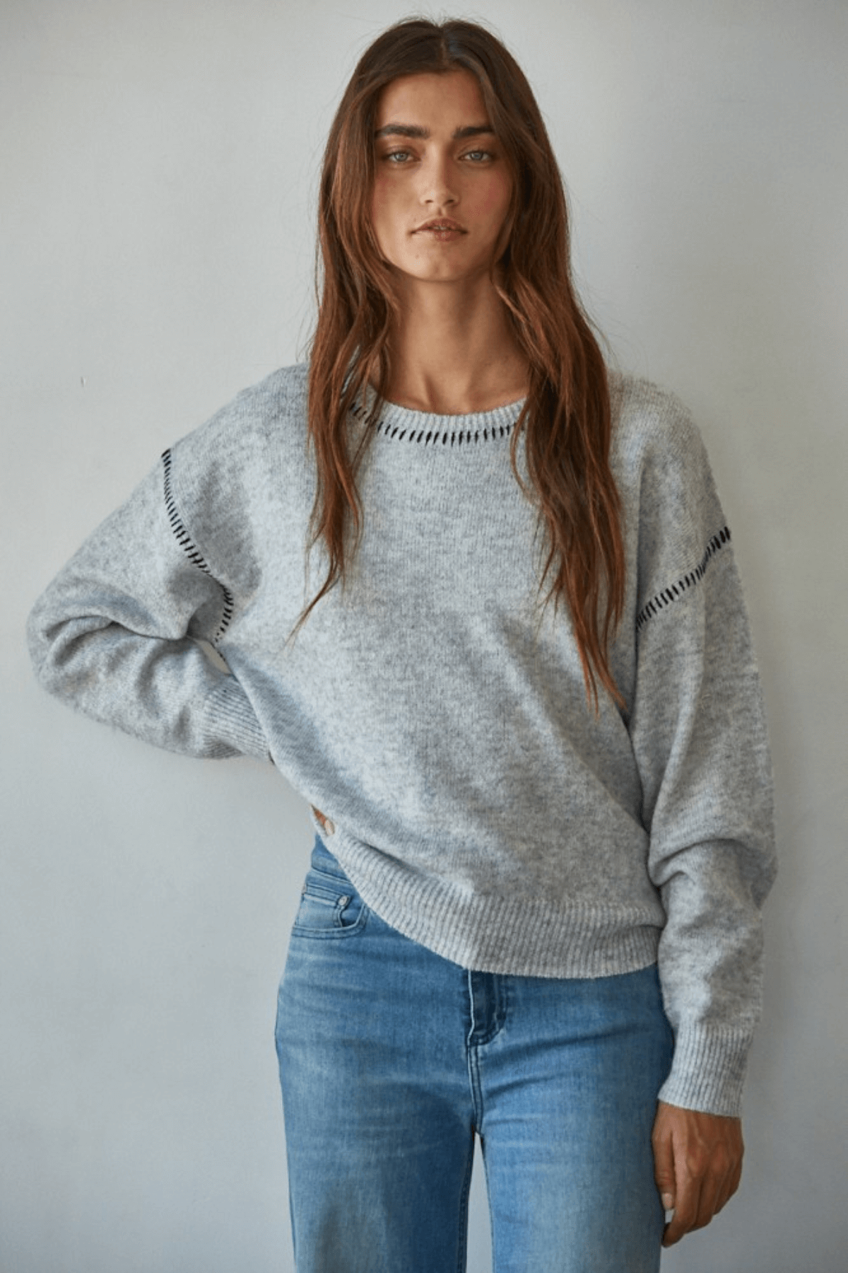 Heather grey crewneck sweater with dark contrast stitch on yoke and sleeves