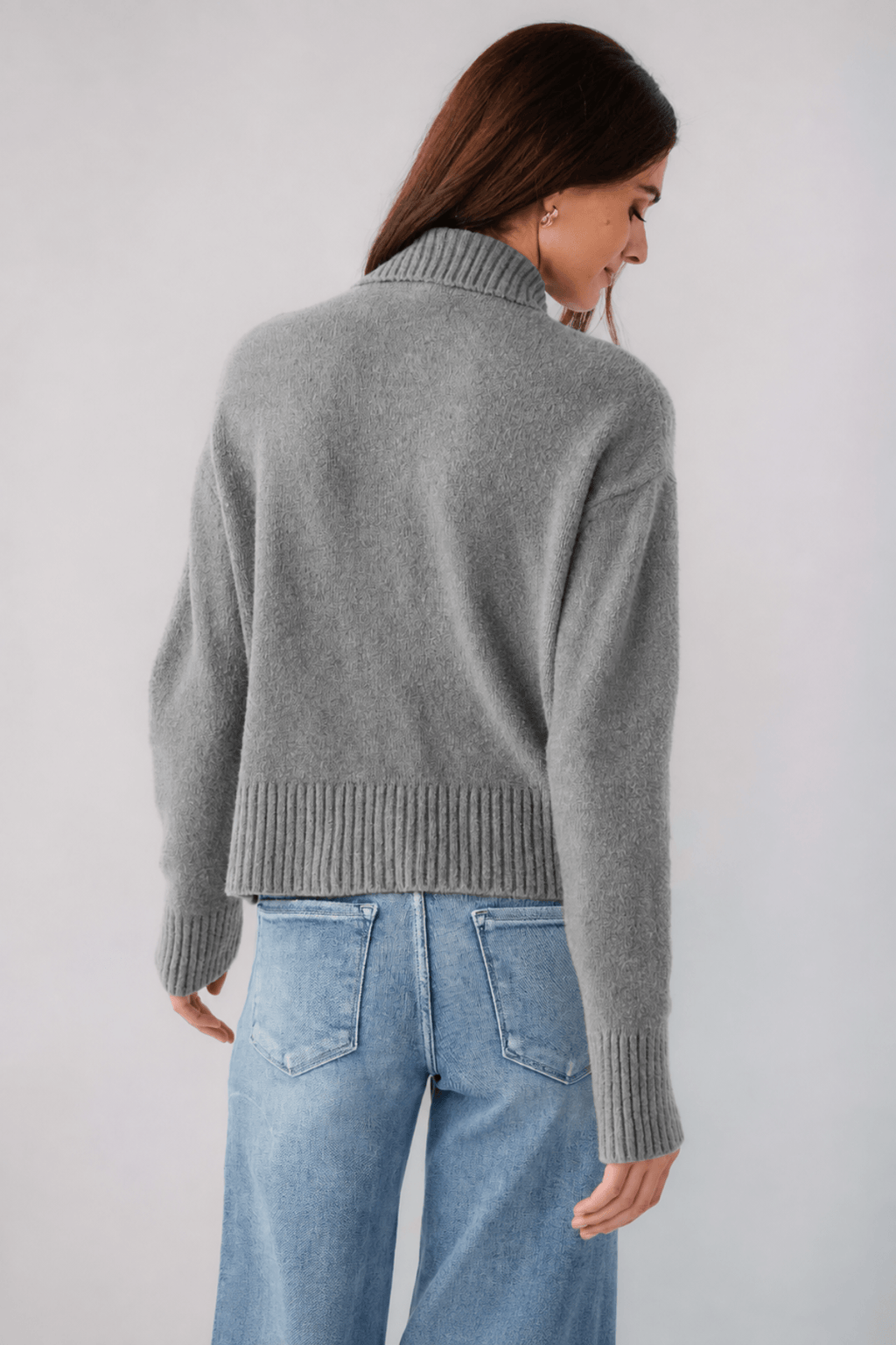 Grey knit polo sweater back view, ribbed hem and cuffs, turn-down collar