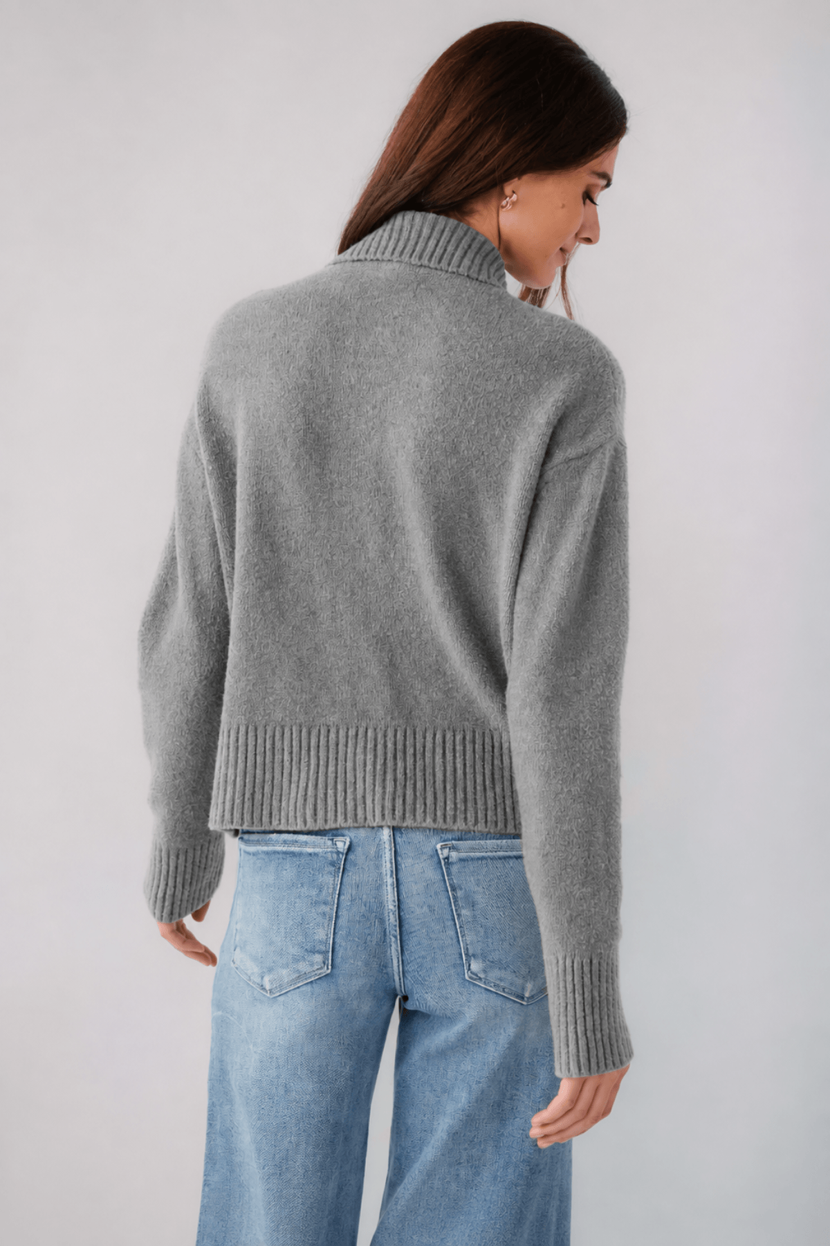 Grey knit polo sweater back view, ribbed hem and cuffs, turn-down collar