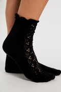 Black crochet detail crew socks with floral lace panel at the ankle