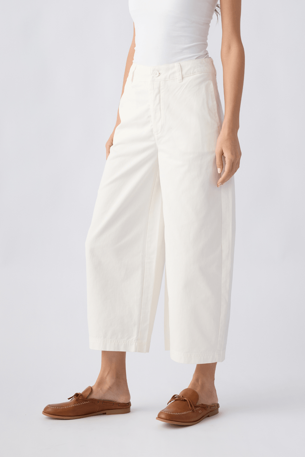 Ivory chino pants, side view with relaxed straight fit, cropped hem and belt loops