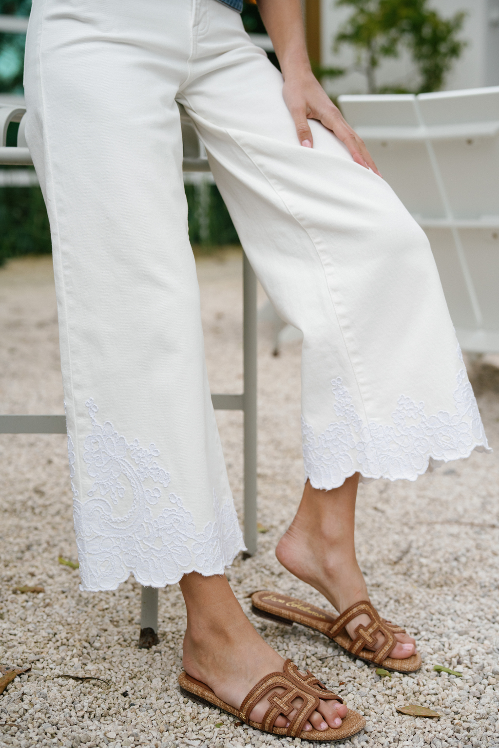 Cream wide-leg crop pants with lace embroidery panel at the hem