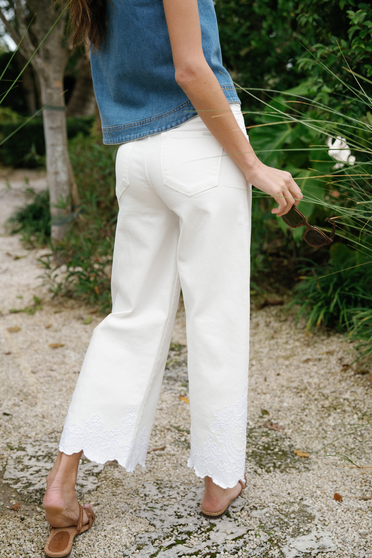 Cream high-rise crop wide-leg pants with lace-trim hem and front pocket seams
