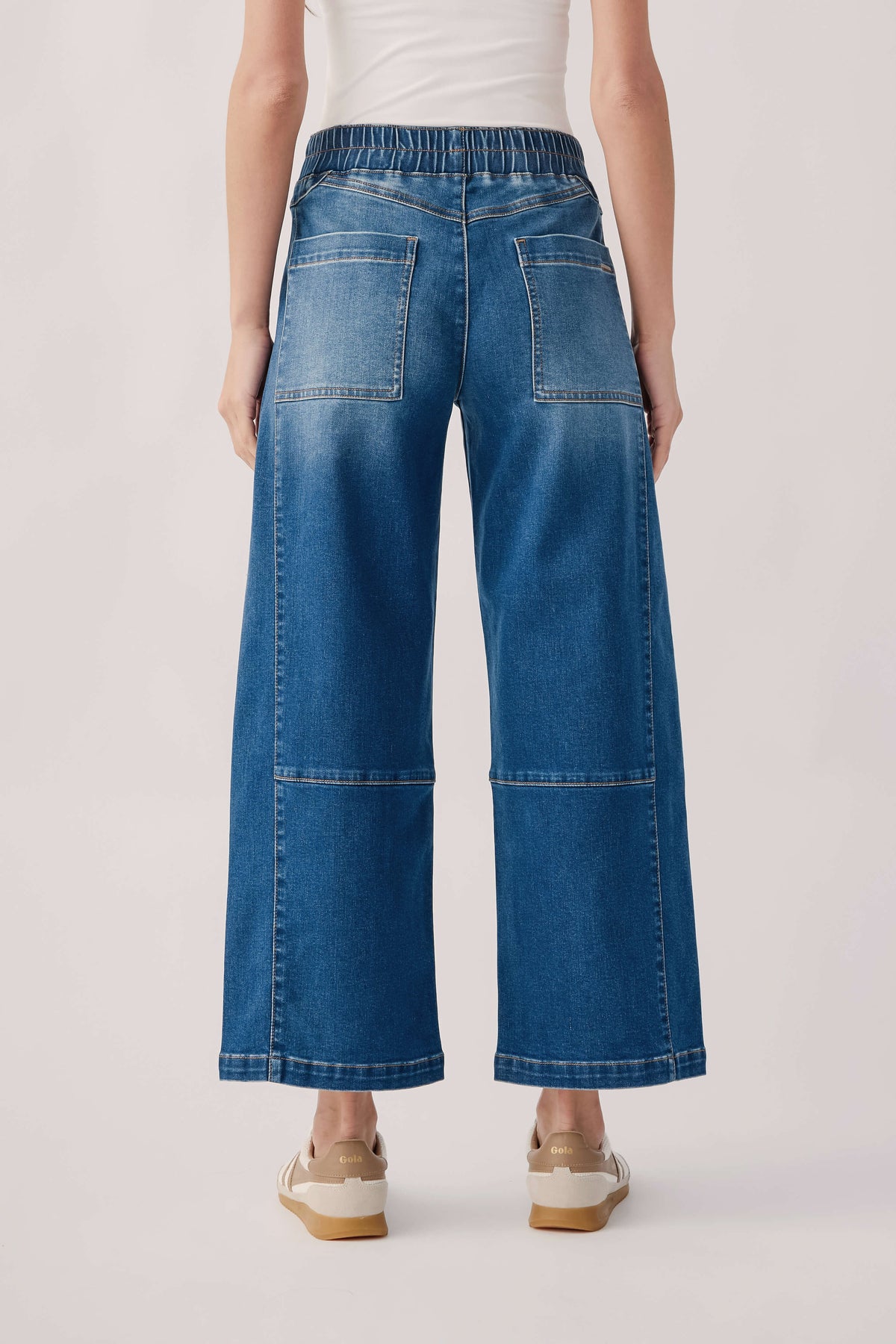 Blue denim pull-on barrel jeans with back patch pockets and wide straight legs