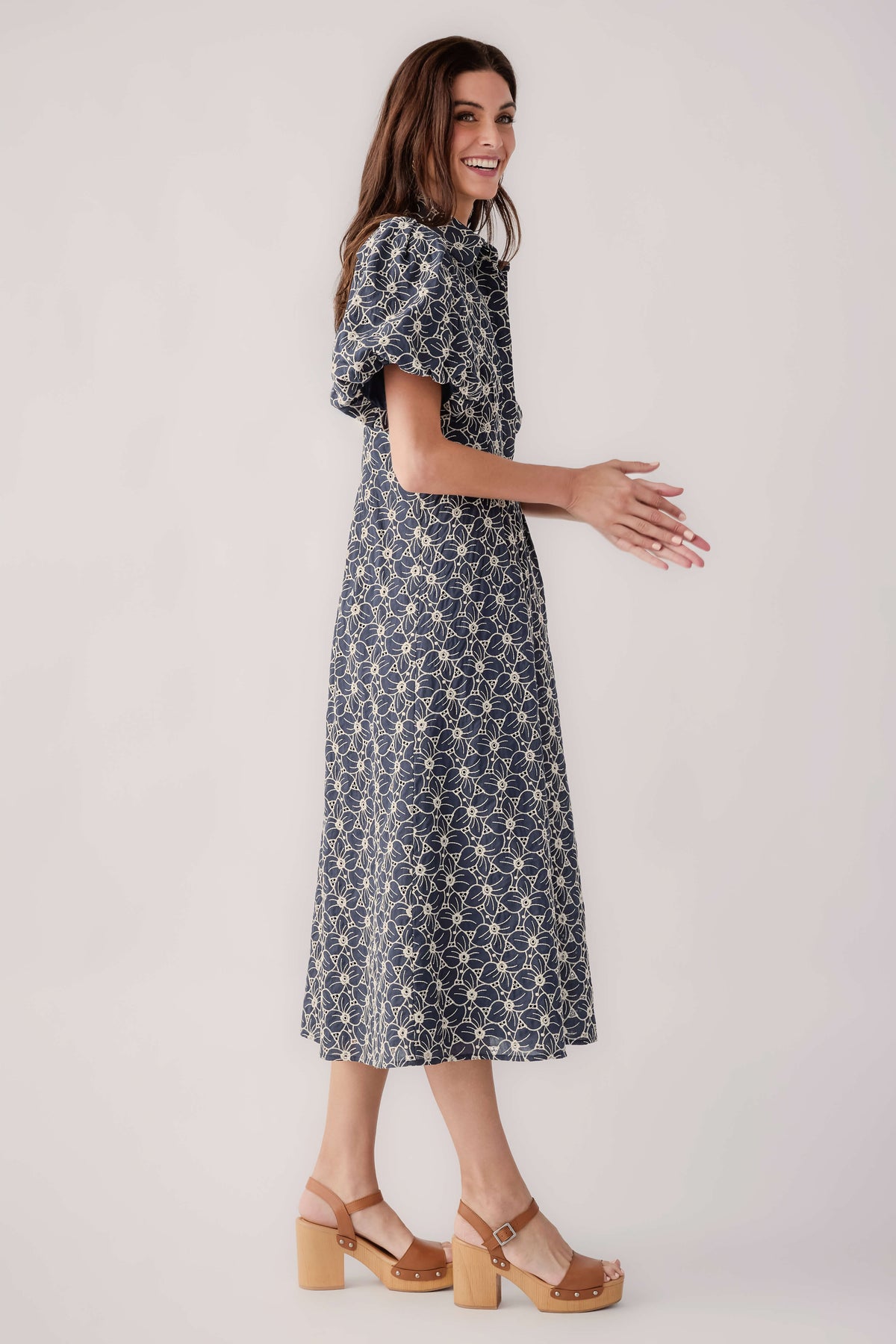 Navy floral eyelet midi dress, side view, short flutter sleeves