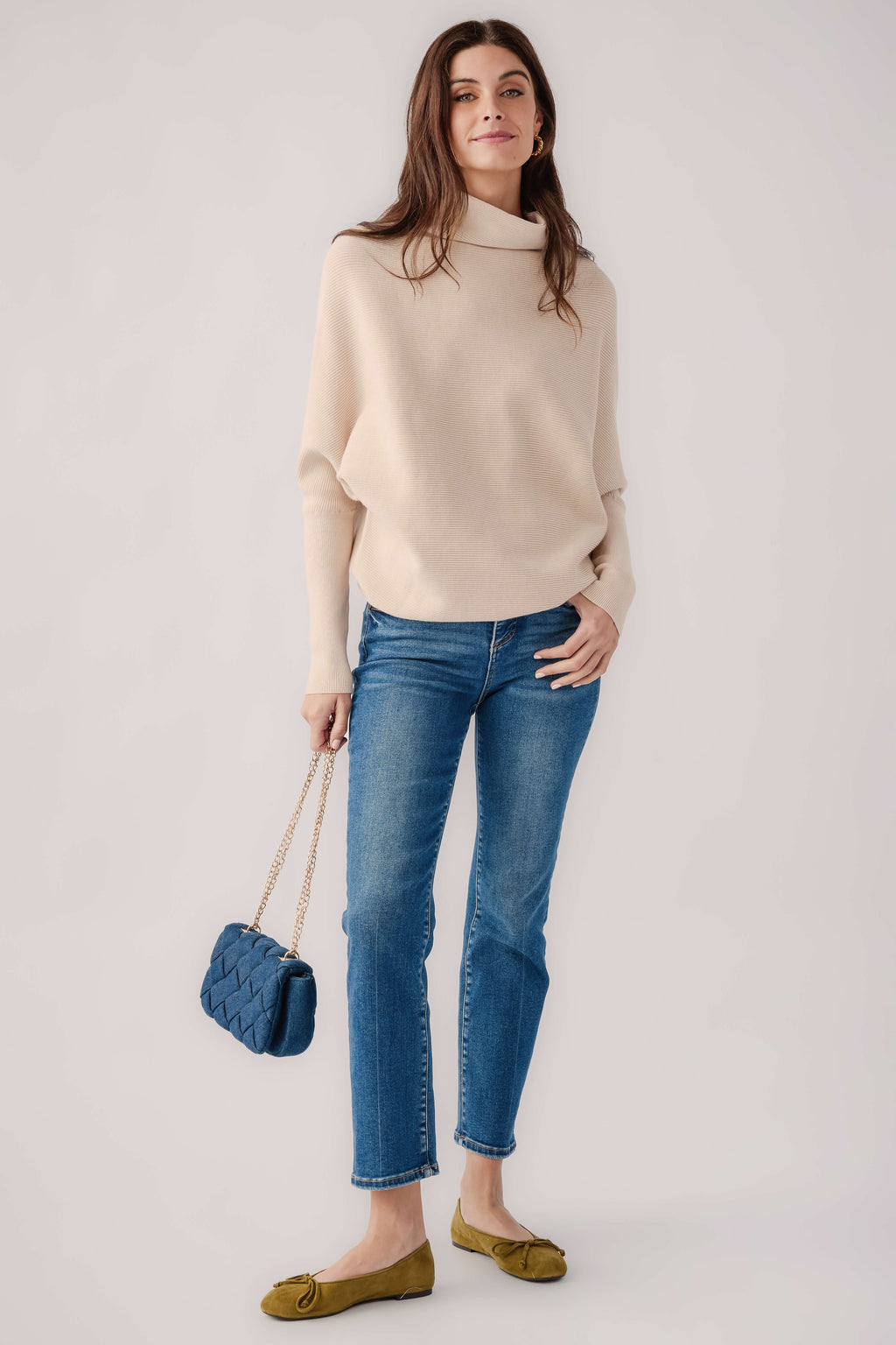 Cream slouch-neck dolman pullover sweater with relaxed, wide sleeves