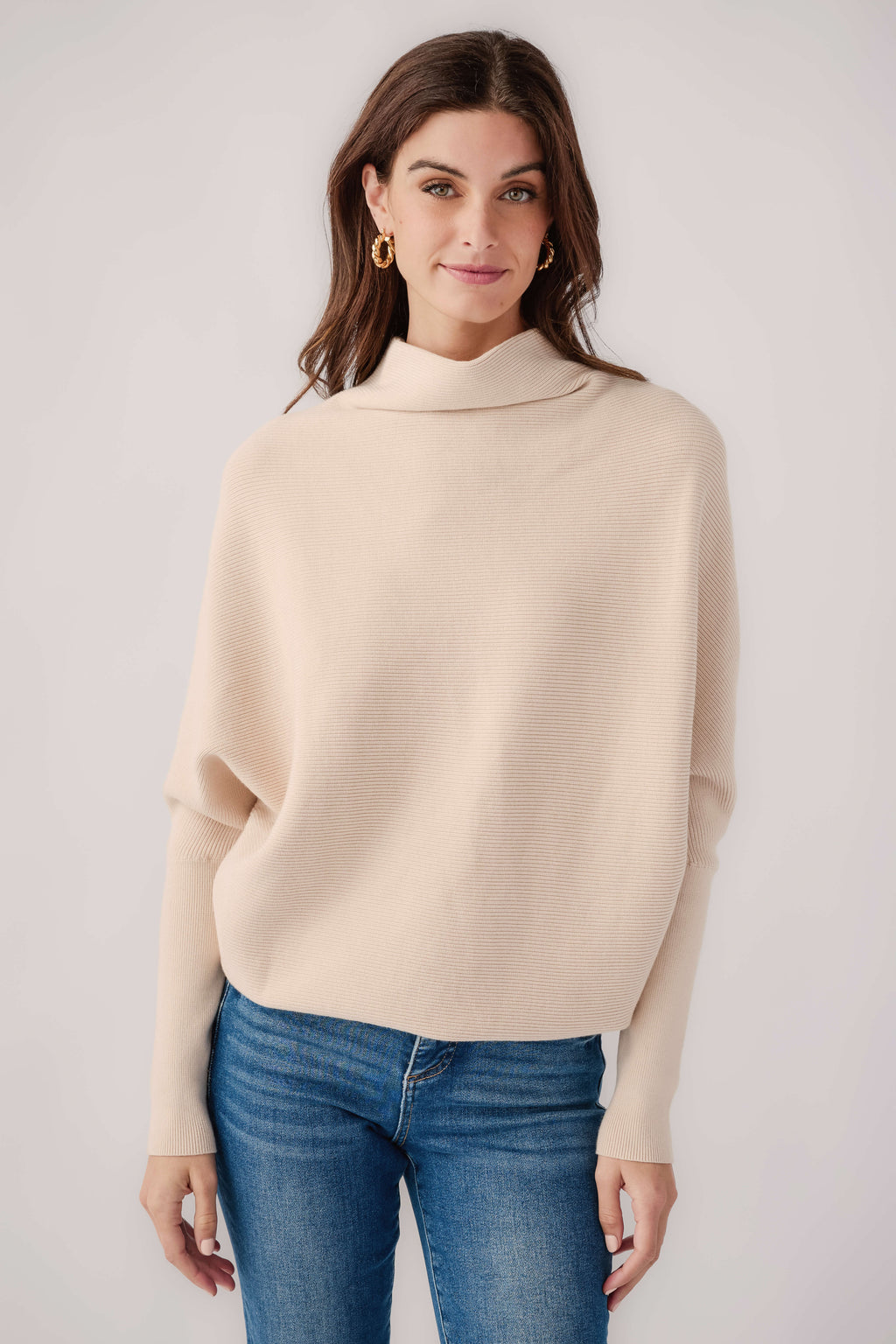 Cream slouch-neck dolman pullover sweater with a relaxed fit