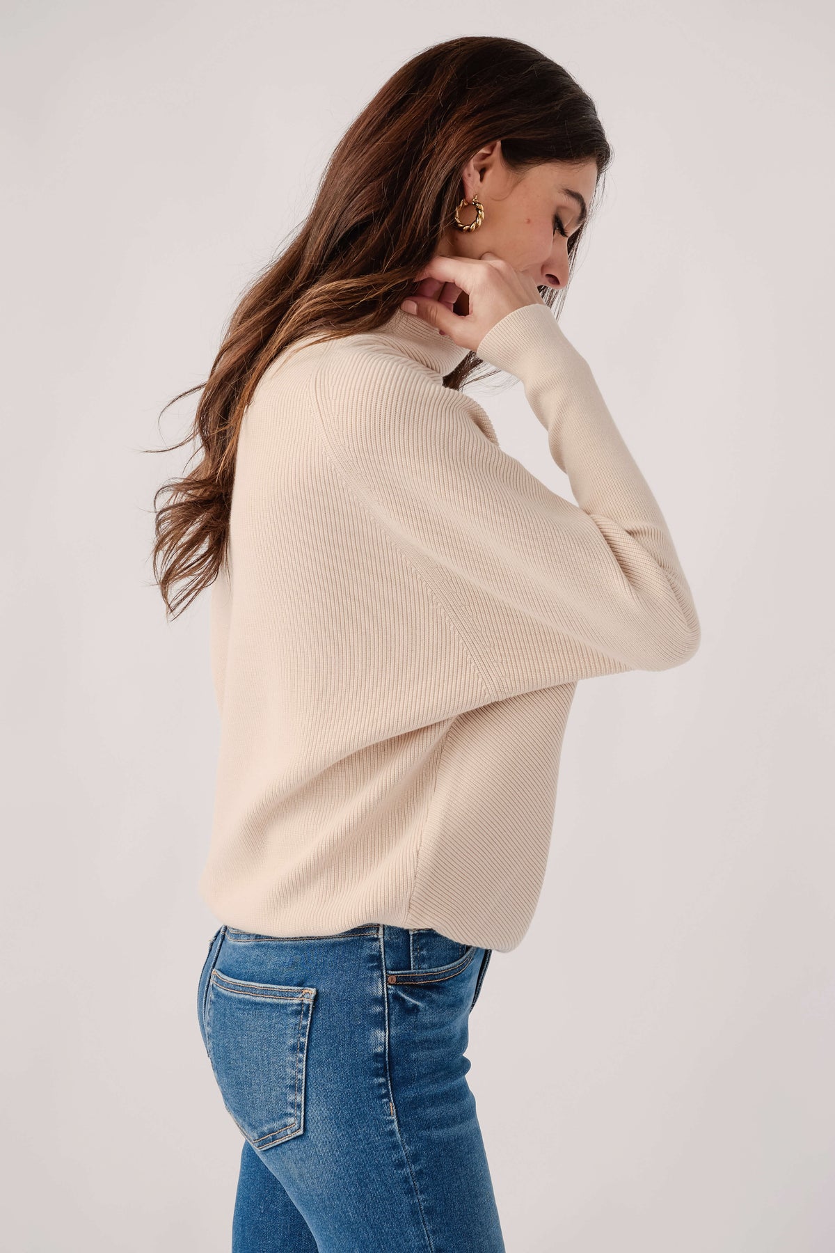 Cream slouch-neck dolman pullover sweater with ribbed neckline