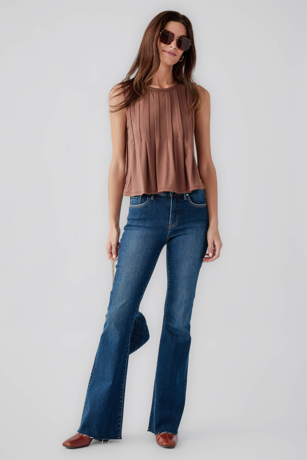 Chocolate sleeveless pleated top with round neck, straight hem