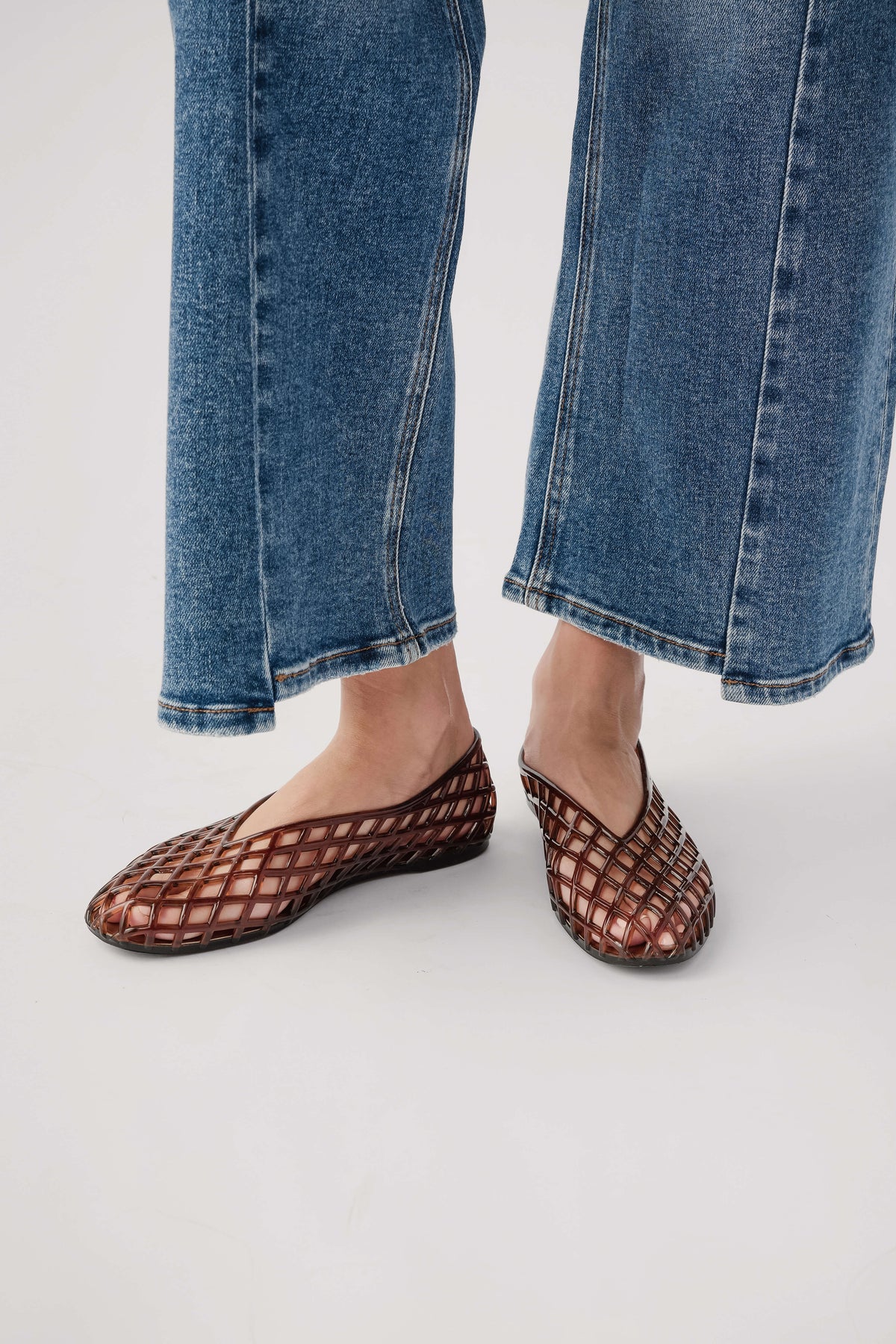 Brown jelly ballet flats with lattice pattern and flat sole