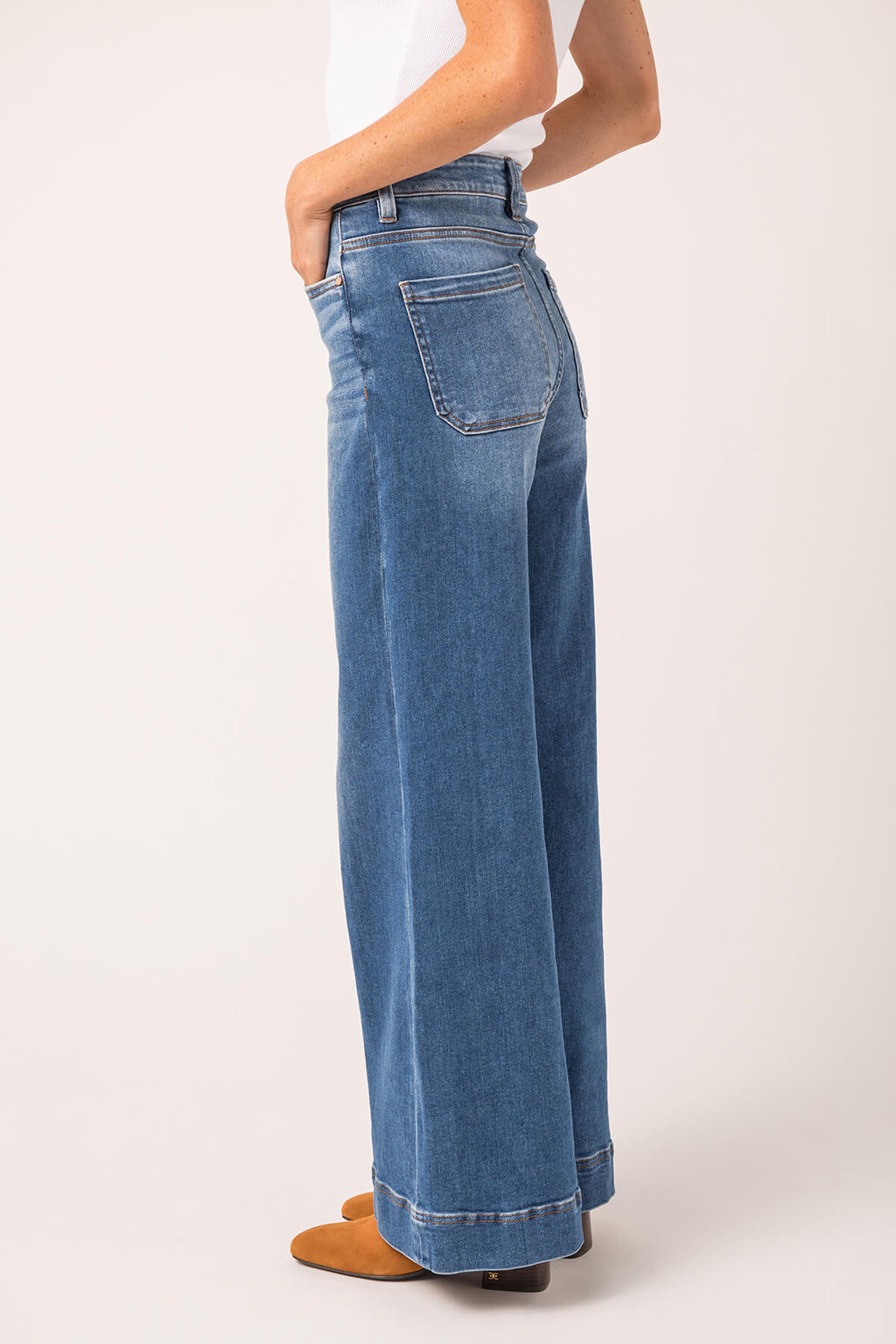 High-rise wide-leg ankle jeans in medium wash blue denim with back patch pockets