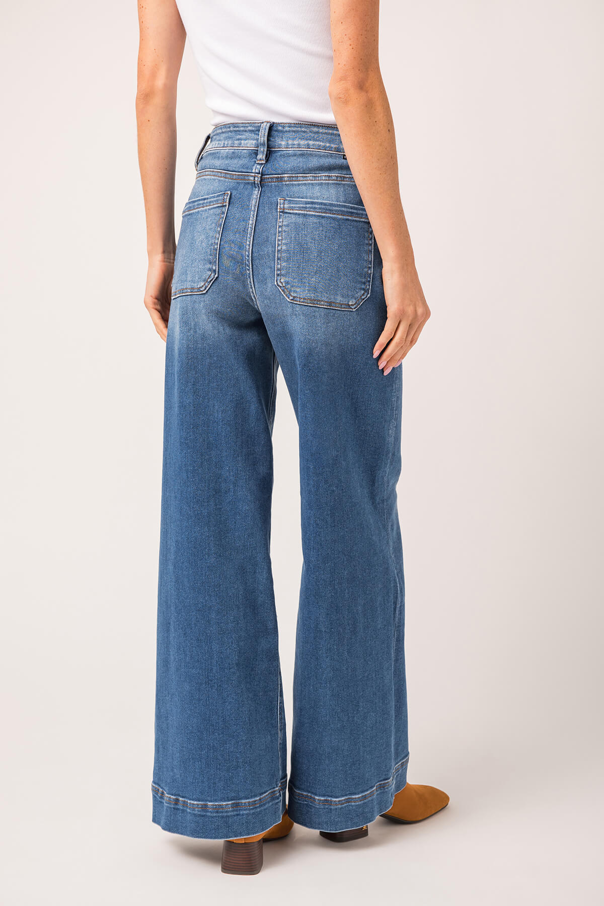 High-rise wide-leg ankle jeans in medium wash blue denim with stitched seam detailing