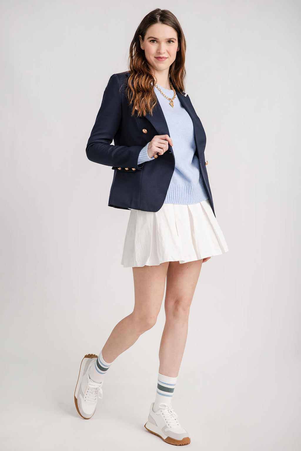 White pleated tennis-style mini skirt with flared hem