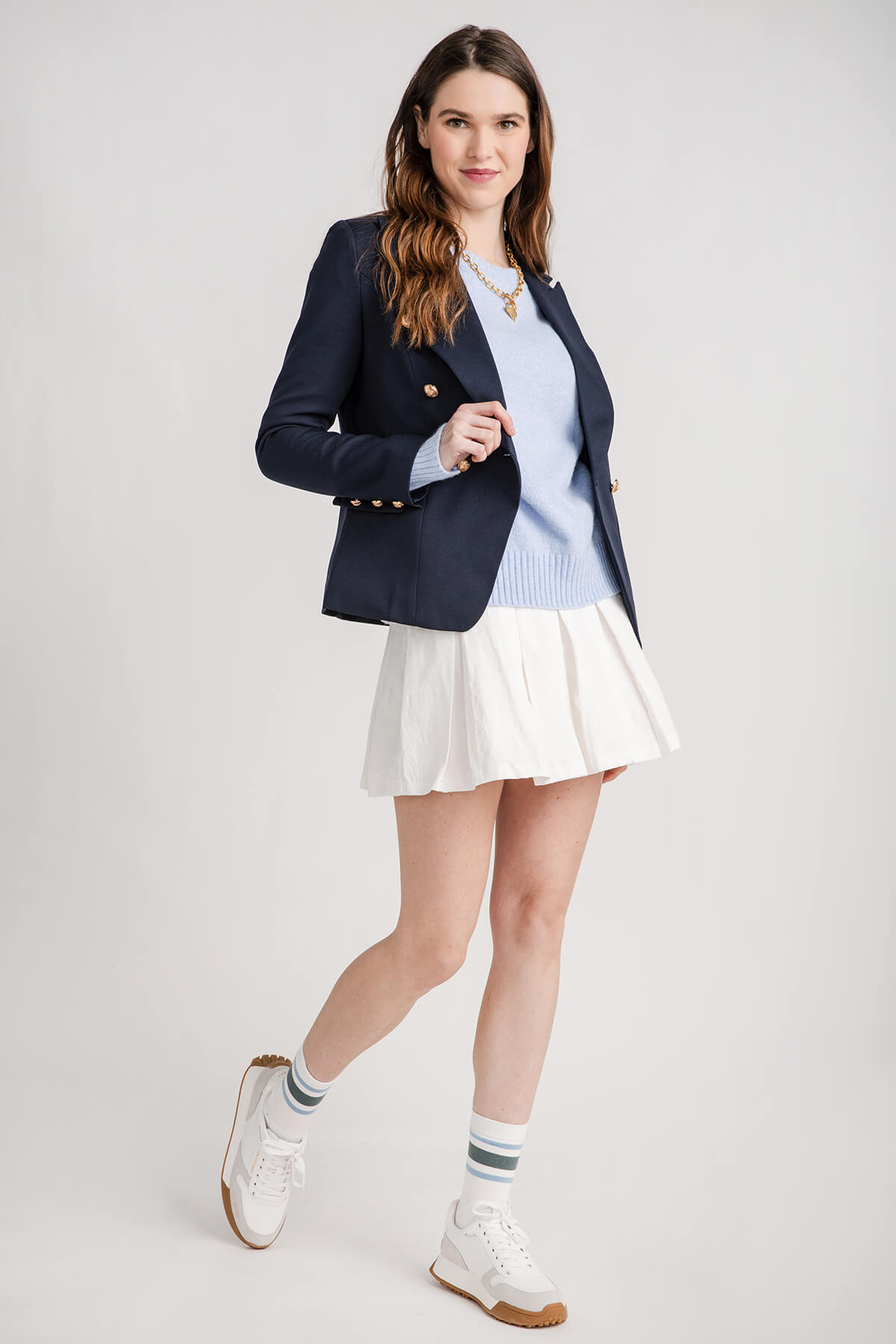 White pleated tennis-style mini skirt with flared hem