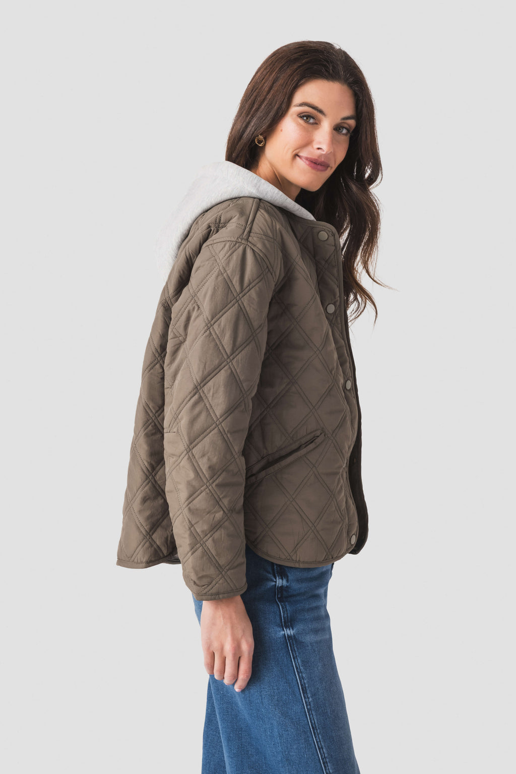 Olive quilted jacket hoodie with raised collar and side profile