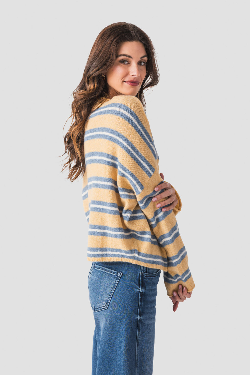 Honey-and-blue striped piper cardigan, side view showing button placket