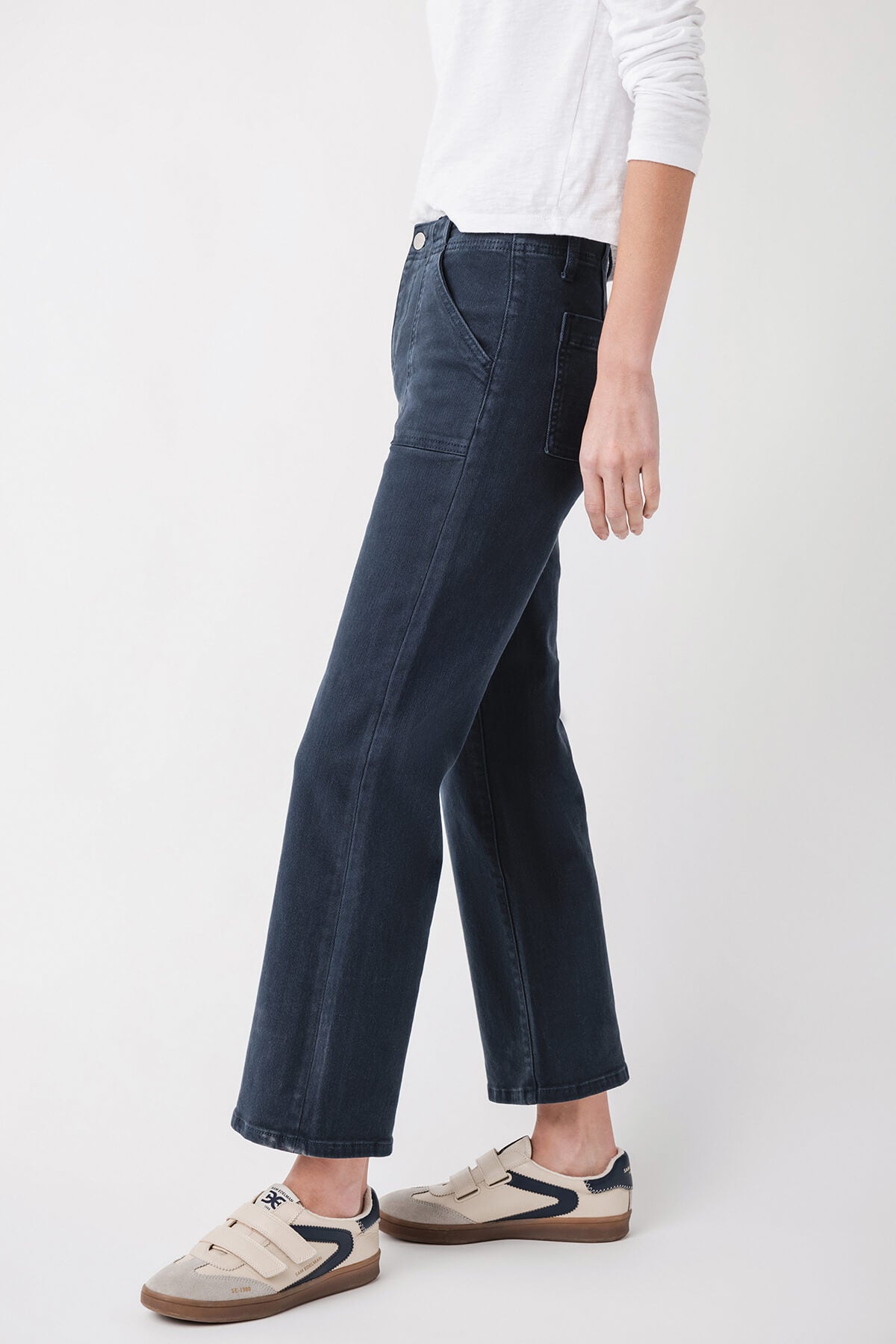 Dark blue ankle flare jeans with front pockets and stitched seams
